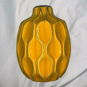 yellow vase with designs